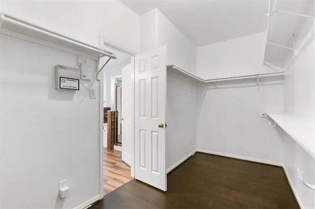a bathroom with a toilet sink and a mirror