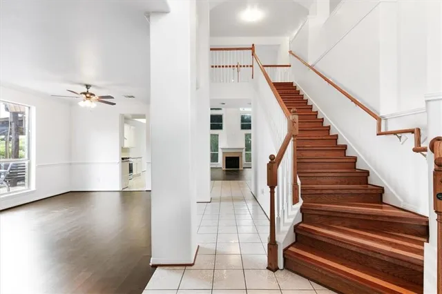 a view of entryway and hall with wooden floor