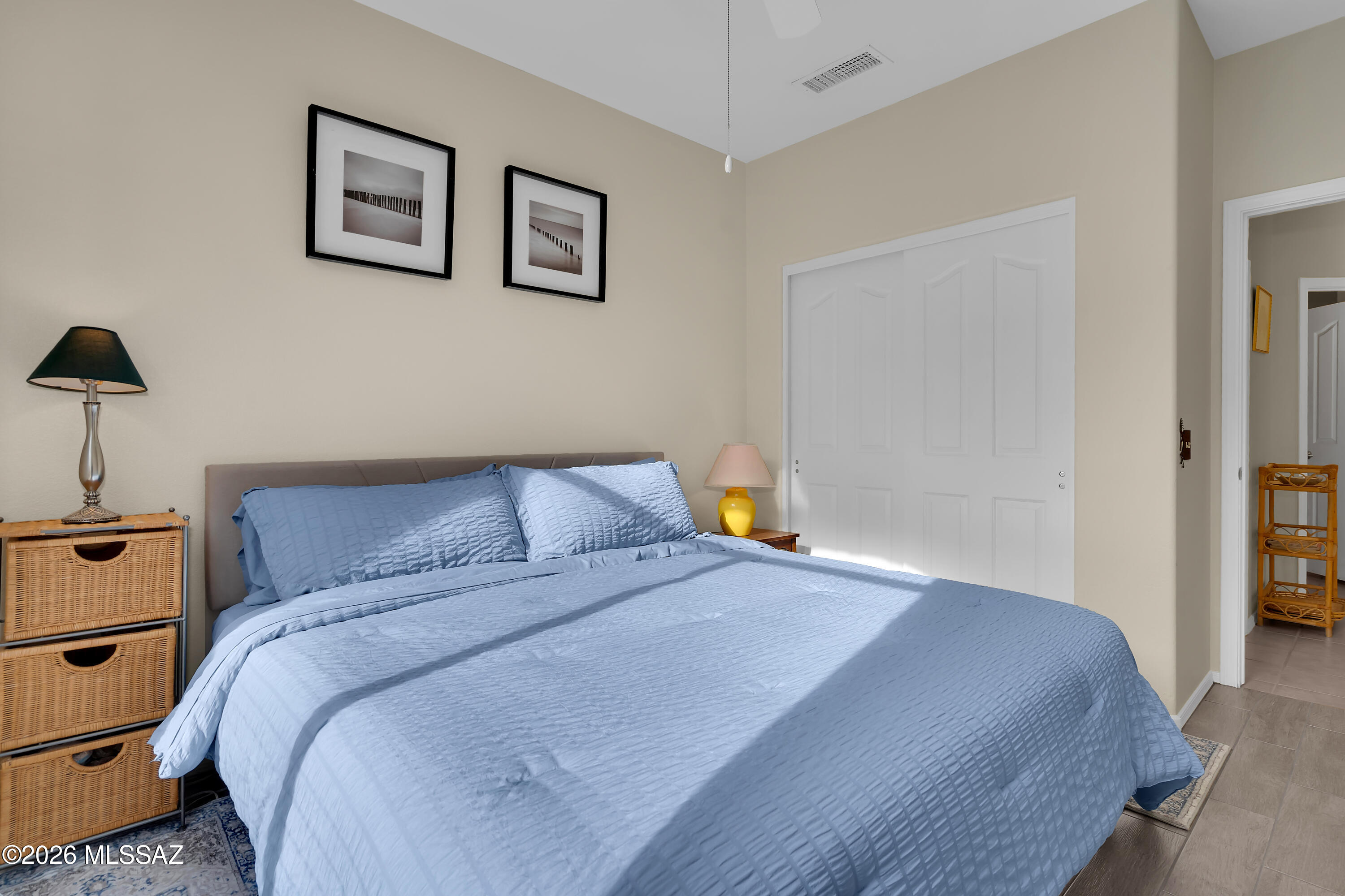 64351 East Wind Ridge Circle Tucson, AZ 85739 - Photo 25 of 41 a bed room with a bed and a night stand