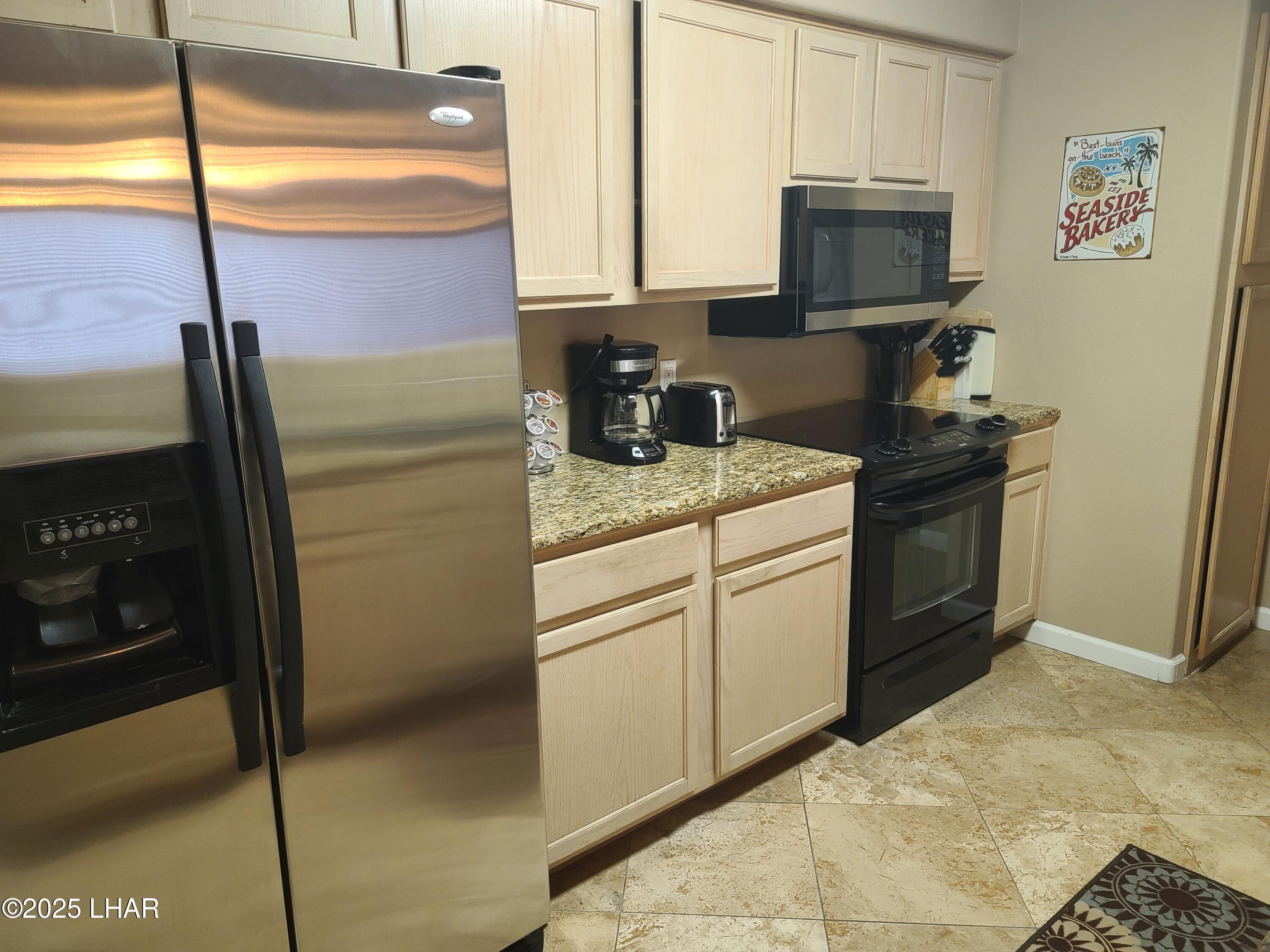 94 London Bridge Road, Unit 108 Lake Havasu City, AZ 86403 - Photo 32 of 38 a kitchen with a sink appliances and cabinets