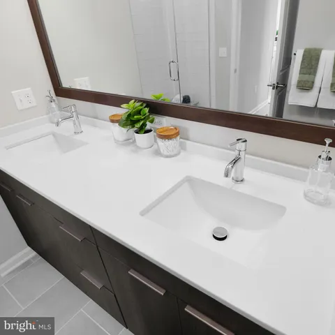 a bathroom with a sink and a large mirror