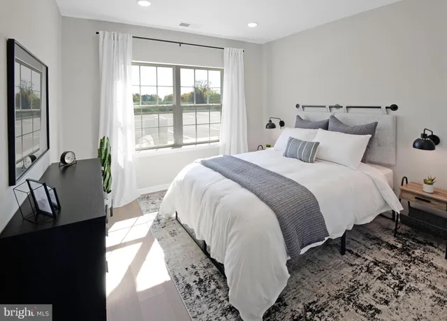 a bed room with a bed and a view of bathroom