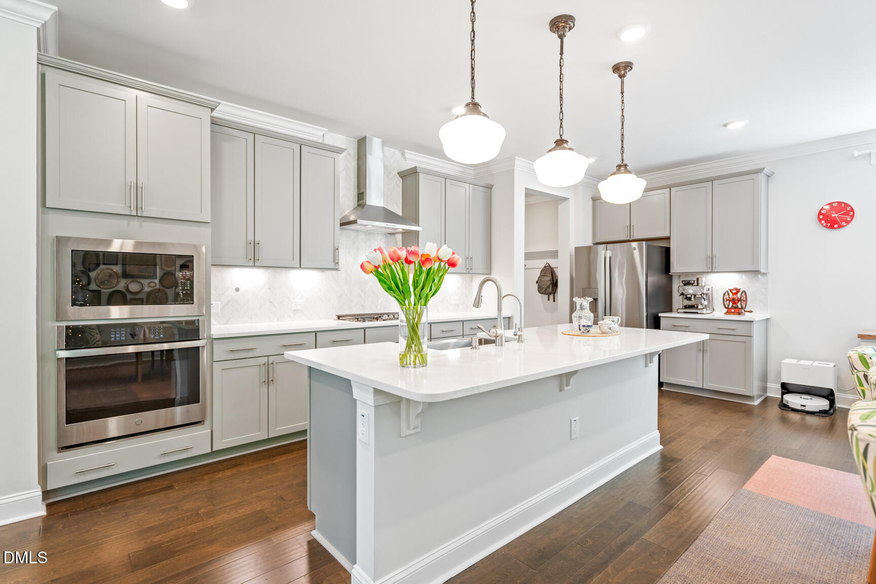 2966 Rise And Shine Road Apex, NC 27502 - Photo 20 of 61 a kitchen with kitchen island granite countertop a sink a stove and a wooden floors