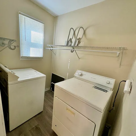 a utility room with dryer and washer