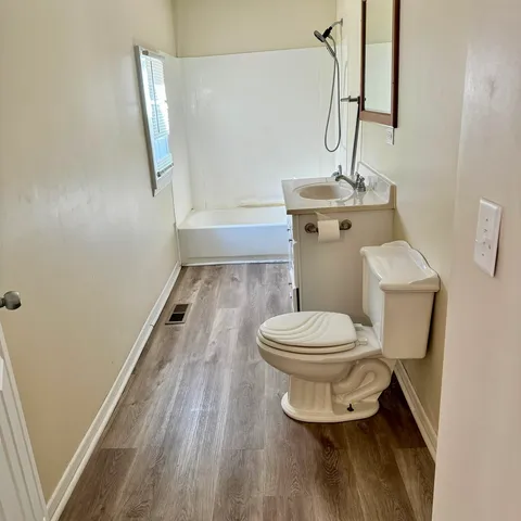 a bathroom with a toilet and a sink