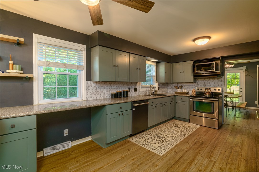 37340 Capel Road Grafton, OH 44044 - Photo 14 of 50 Stainless appliances accentuate the great cabinet color