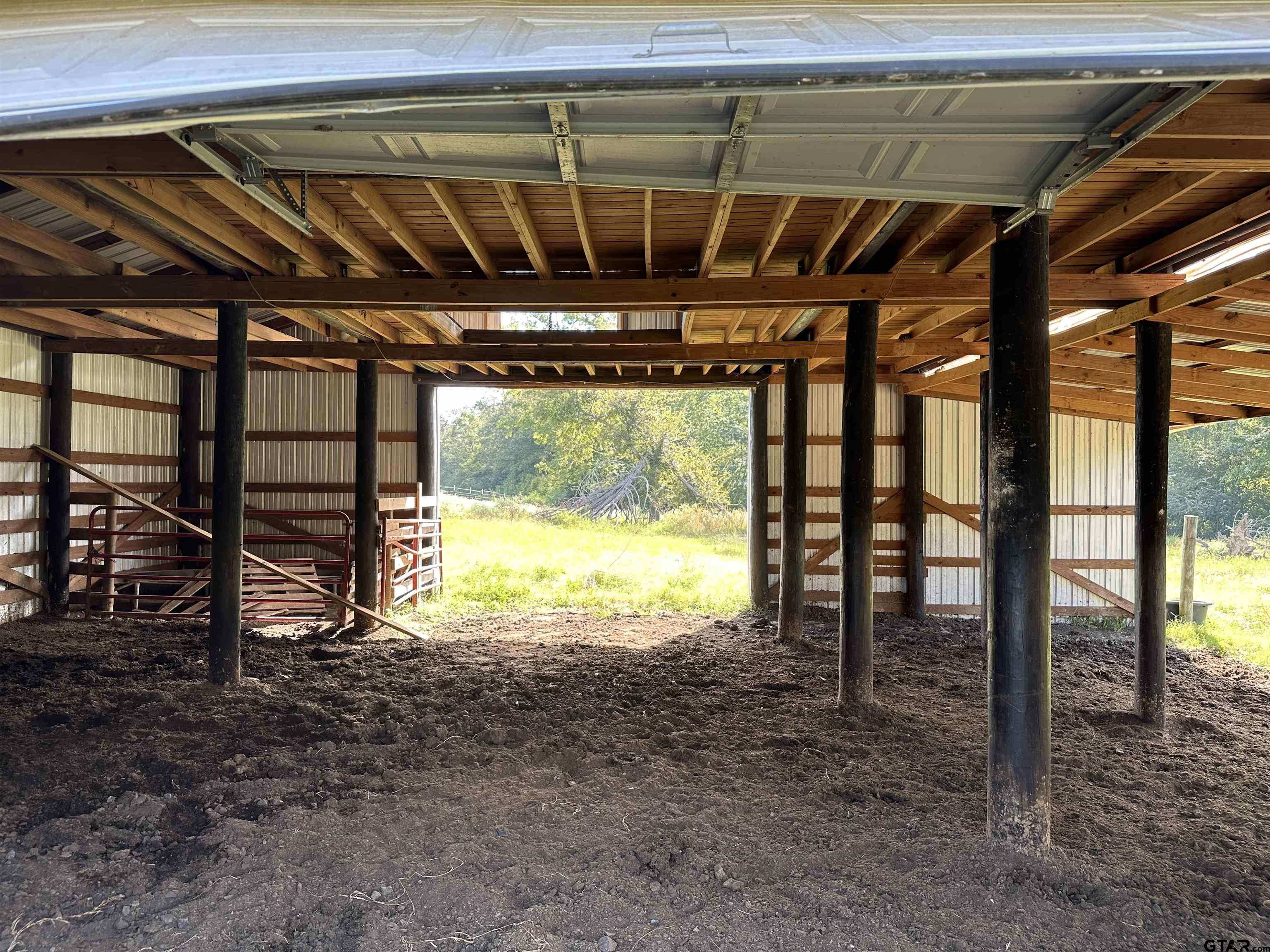 204 East St Rusk Tx 75785 Rusk, TX 75785 - Photo 9 of 20 a view of an empty room with a floor to ceiling window and a table