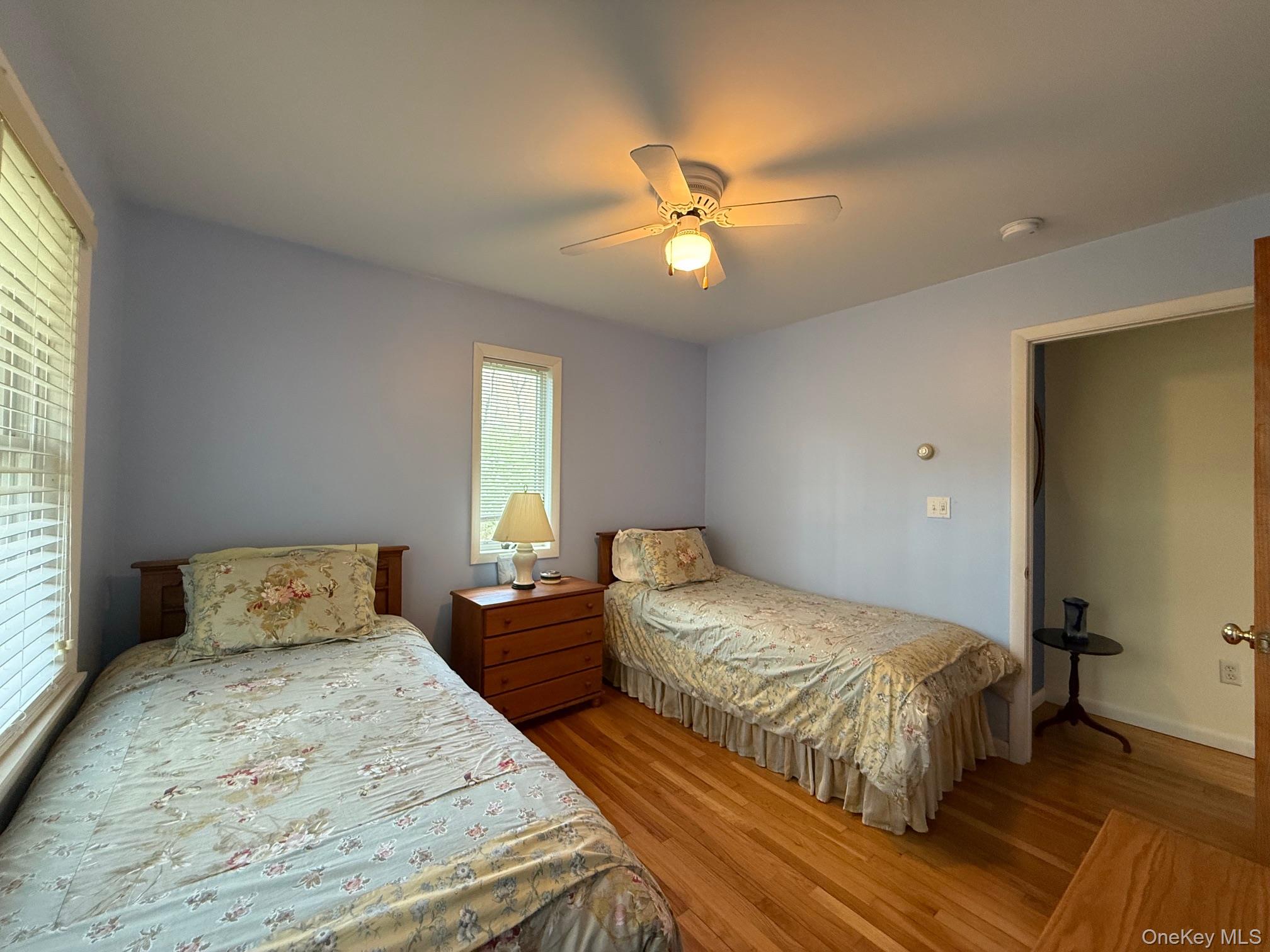 230 Cooper Road Millerton, NY 12546 - Photo 15 of 20 a bedroom with two beds and a chandelier