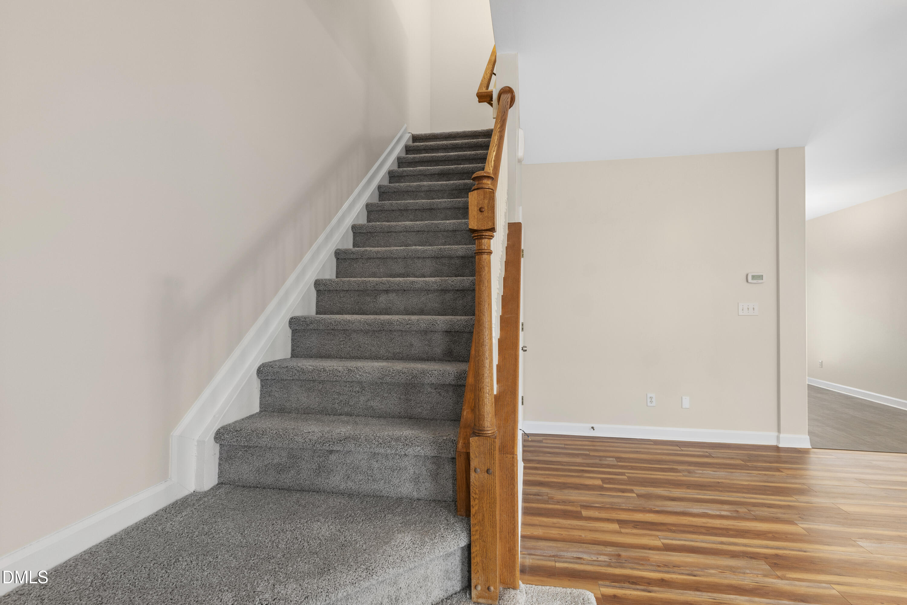 6013 San Marcos Way Raleigh, NC 27616 - Photo 11 of 21 a view of staircase with white walls