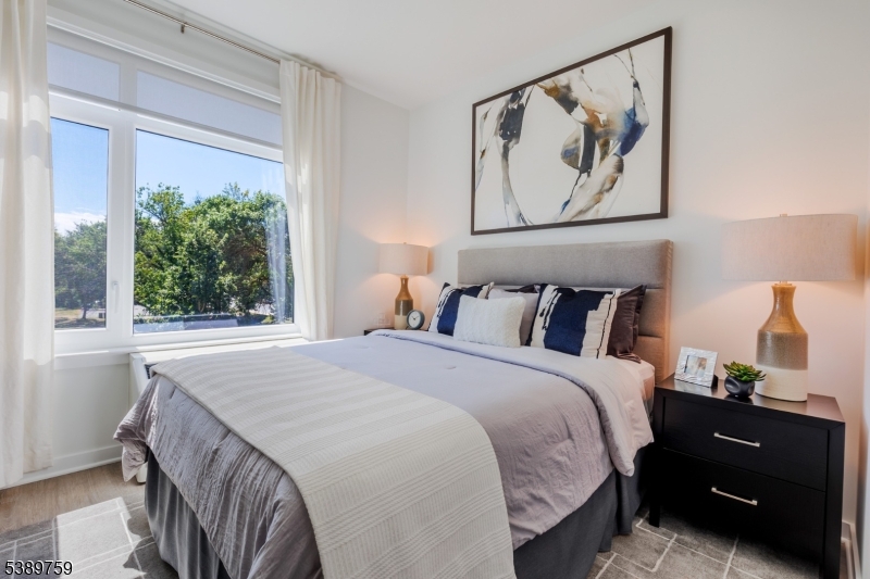 1181 Morris Avenue, Unit 201 Union, NJ 07083 - Photo 6 of 11 a bedroom with a bed and a window