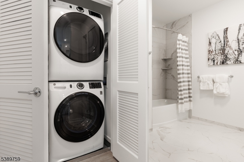 1181 Morris Avenue, Unit 201 Union, NJ 07083 - Photo 7 of 11 a view of a hallway with washer and dryer