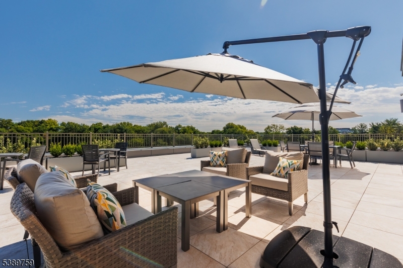 1181 Morris Avenue, Unit 201 Union, NJ 07083 - Photo 9 of 11 a view of a terrace with furniture and a yard