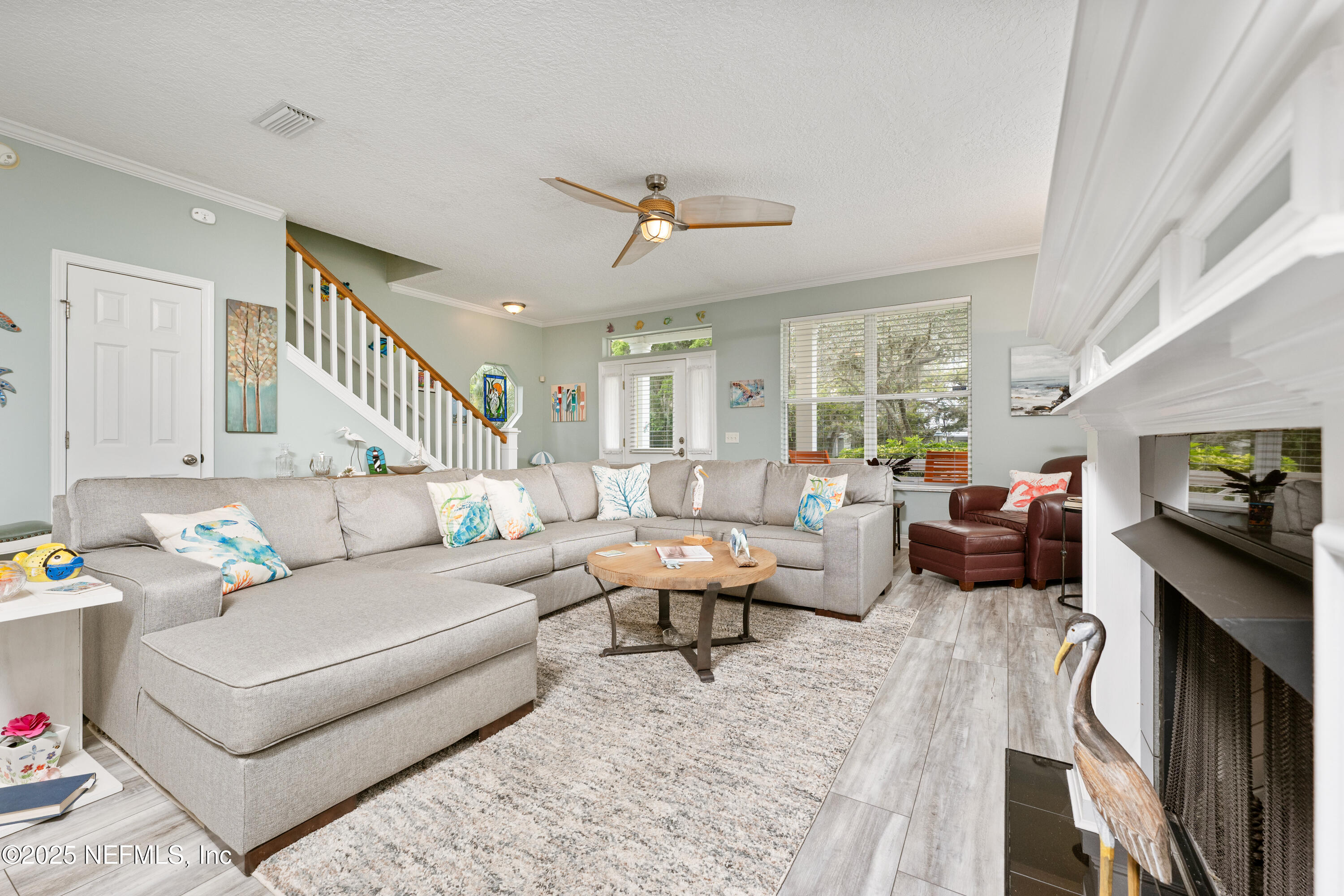 2500 Hydrangea Street St. Augustine, FL 32080 - Photo 12 of 56 a living room with furniture and a flat screen tv