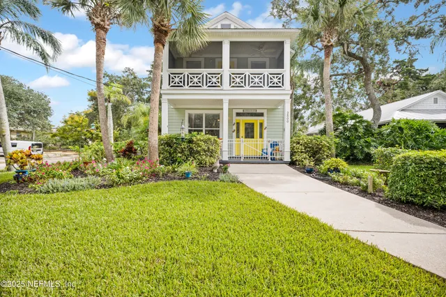 a view of a swimming pool with a patio and a yard