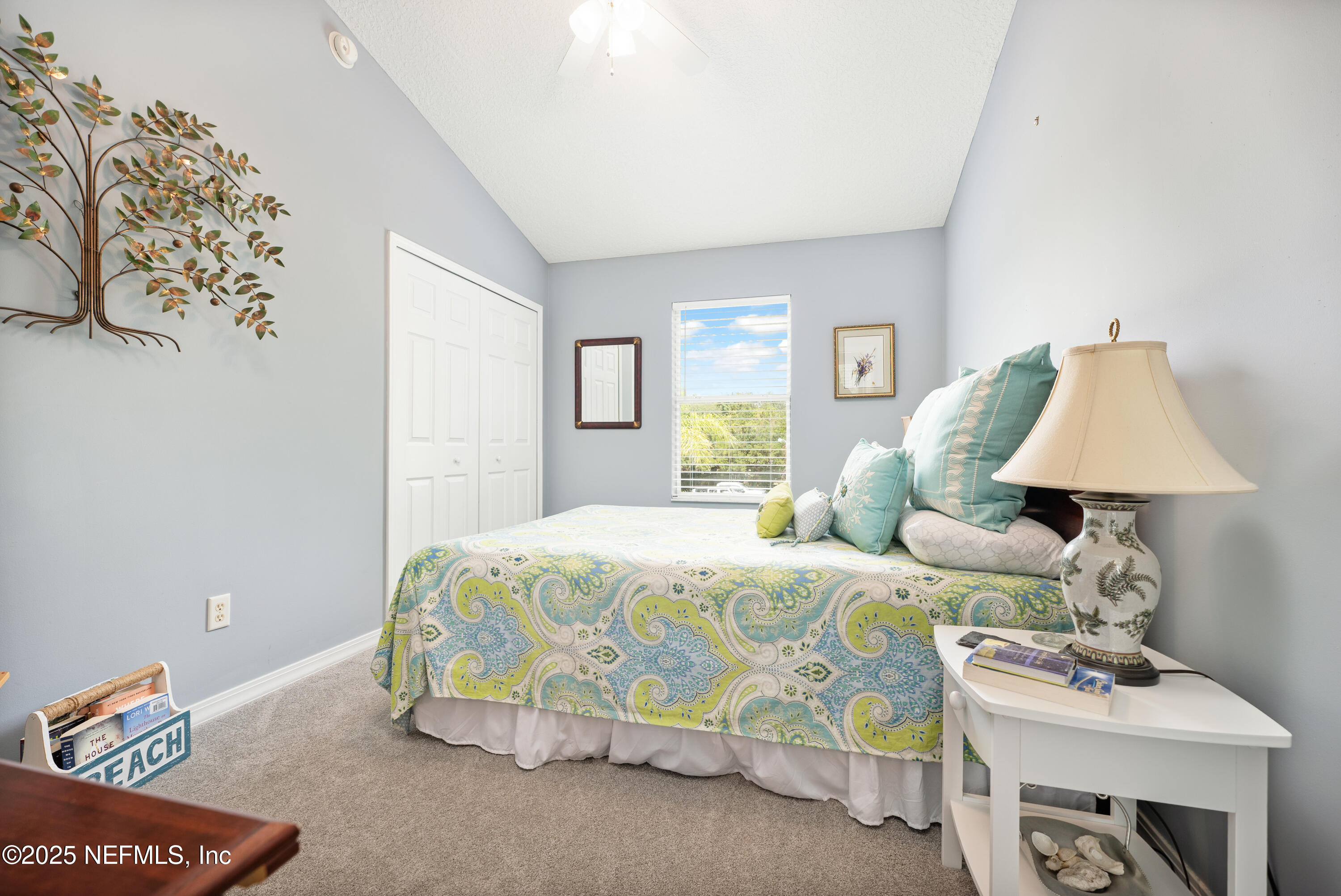 2500 Hydrangea Street St. Augustine, FL 32080 - Photo 28 of 56 a bedroom with bed and a table