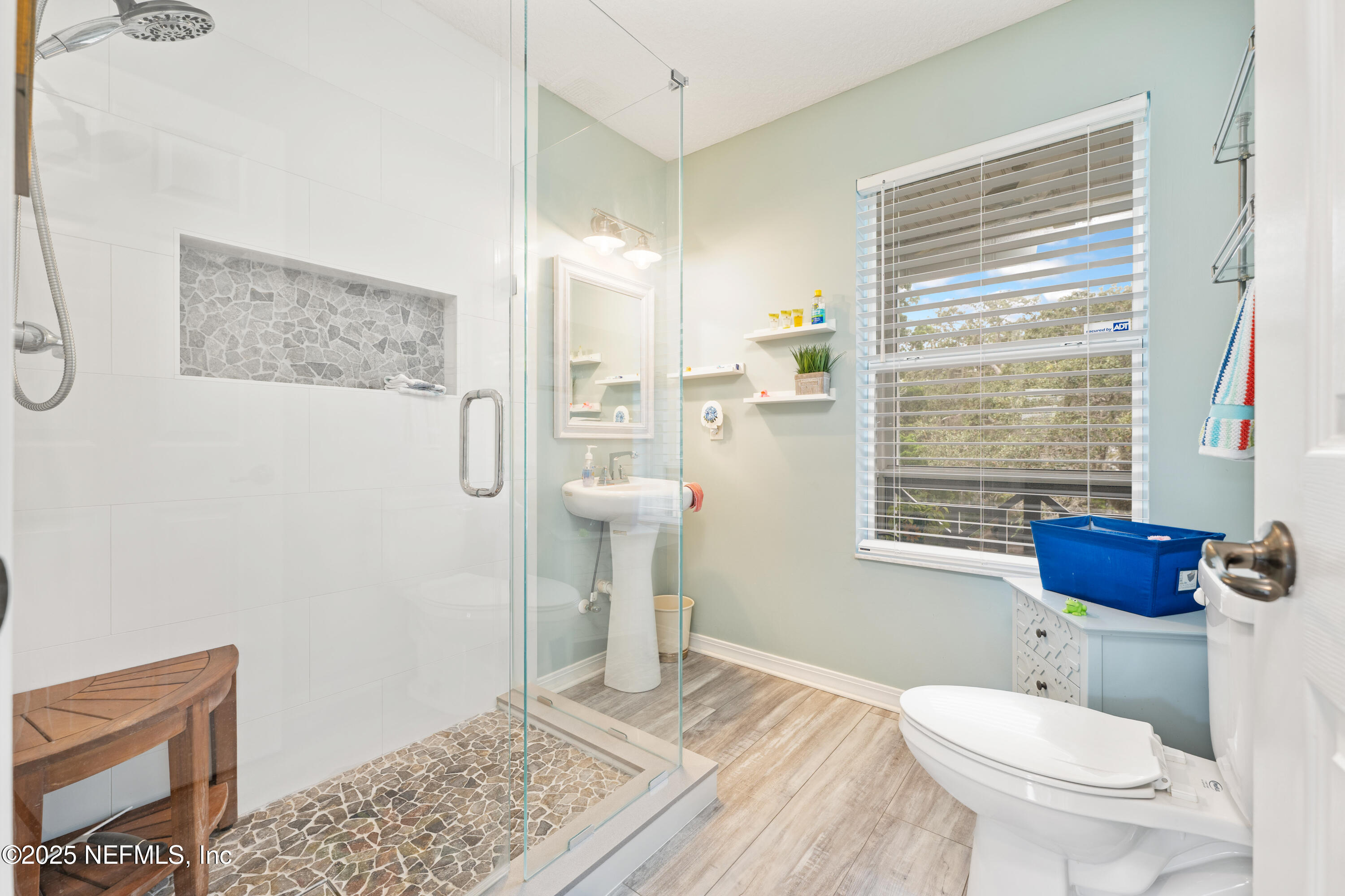 2500 Hydrangea Street St. Augustine, FL 32080 - Photo 29 of 56 a bathroom with a toilet sink and shower