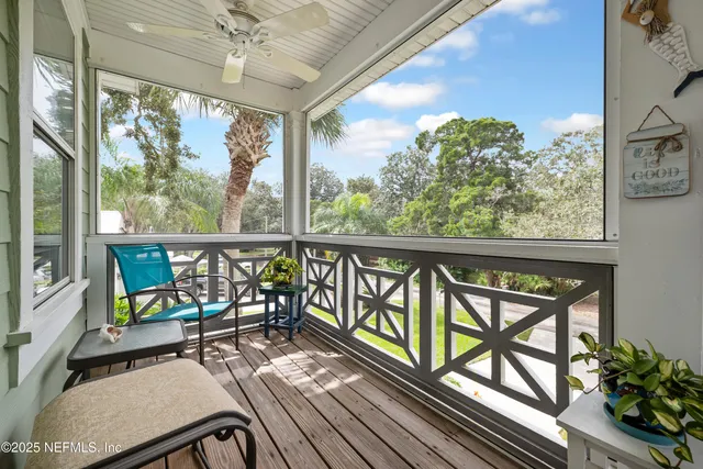 a view of a chairs and table in the patio