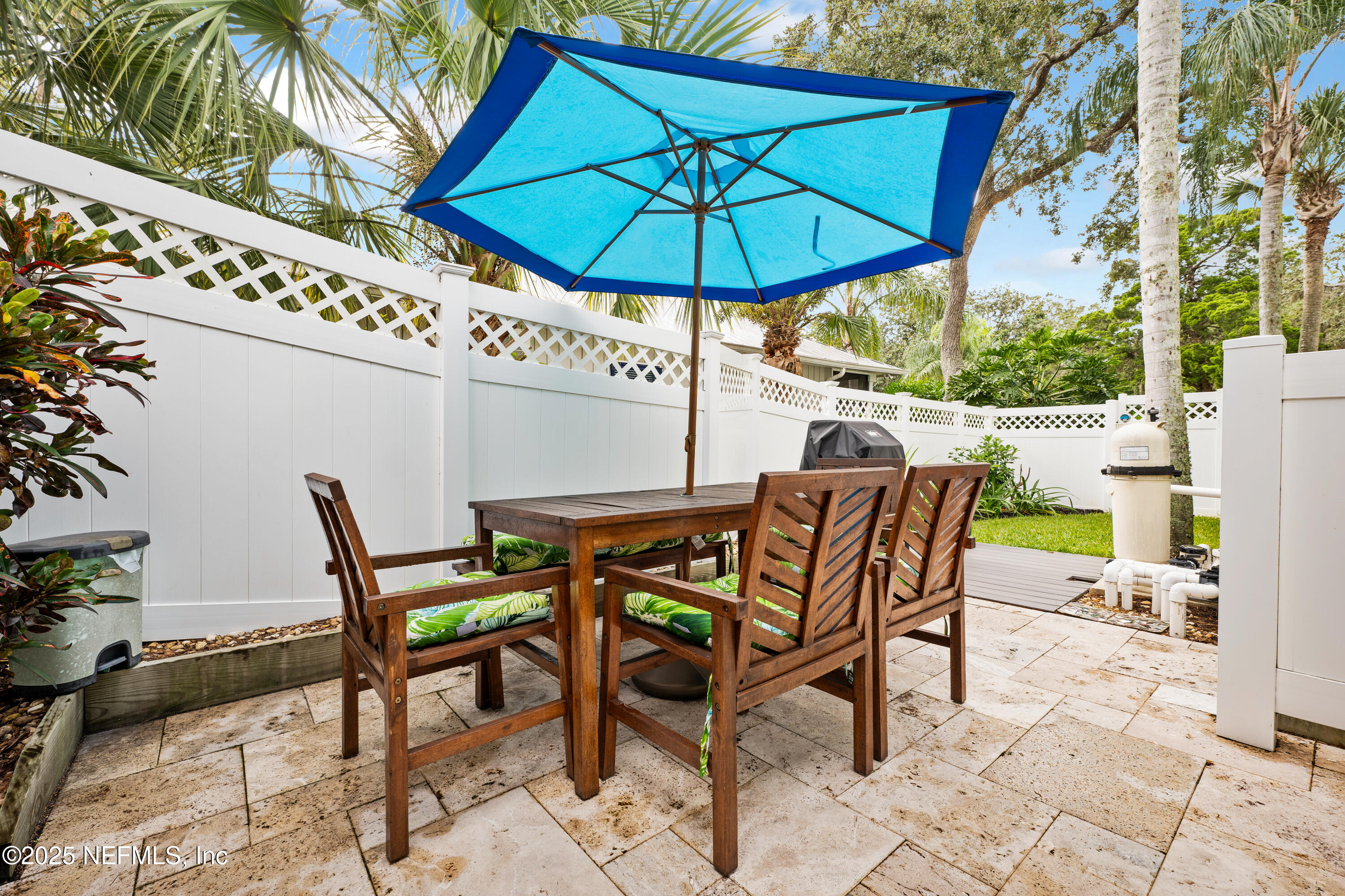 2500 Hydrangea Street St. Augustine, FL 32080 - Photo 40 of 56 a view of an outdoor space with furniture and umbrella