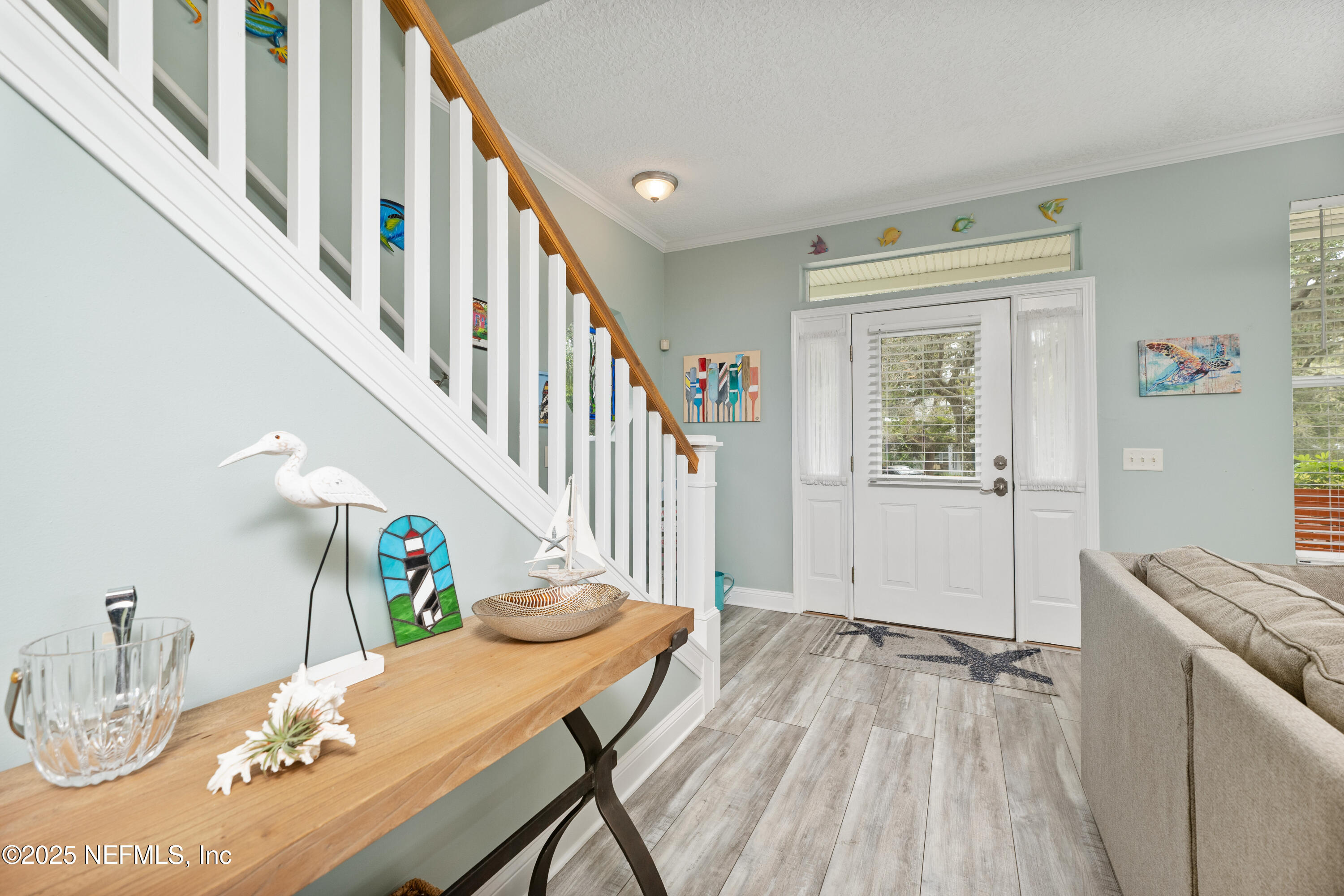 2500 Hydrangea Street St. Augustine, FL 32080 - Photo 10 of 56 a dining room with furniture a rug and wooden floor