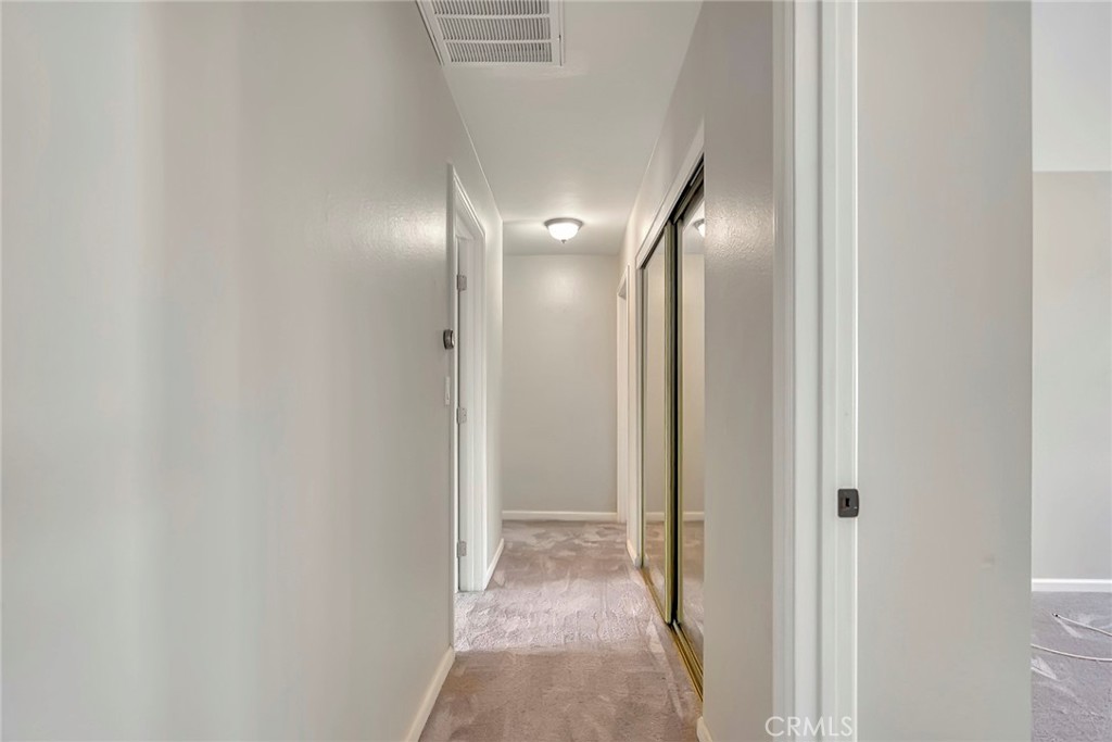 1115 South Groveland Place Anaheim, CA 92806 - Photo 22 of 42 a view of a hallway with wooden floor