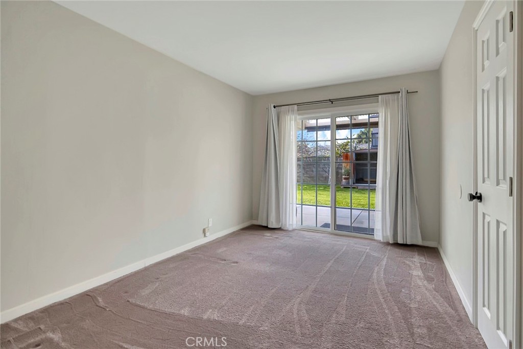 1115 South Groveland Place Anaheim, CA 92806 - Photo 25 of 42 a view of an empty room with a sliding door