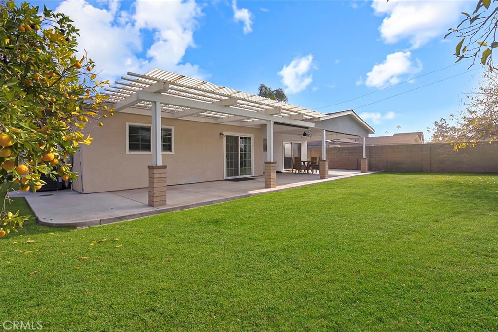 1115 South Groveland Place Anaheim, CA 92806 - Photo 41 of 42 a front view of house with a garden and patio
