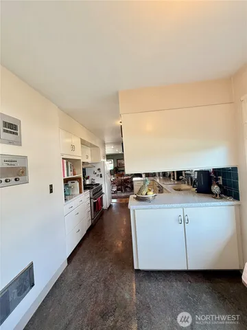 a view of a livingroom with furniture and windows