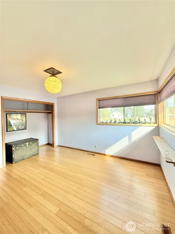 a view of a room with painting on the wall