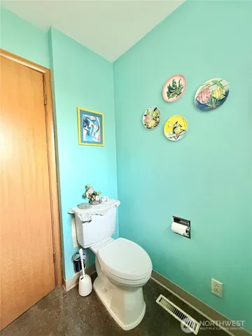 a view of a livingroom with wooden floor and fireplace