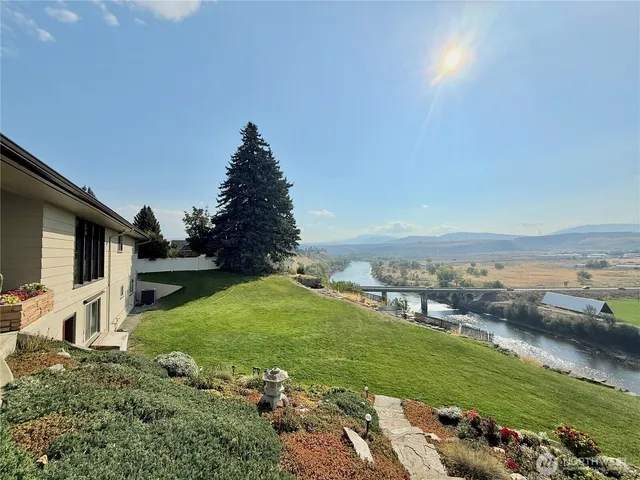 a view of a balcony with floor to ceiling windows