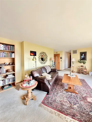 a living room with furniture and a table