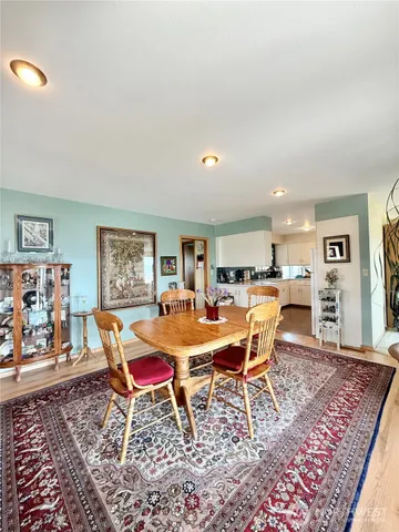 a dining room with a table and chairs
