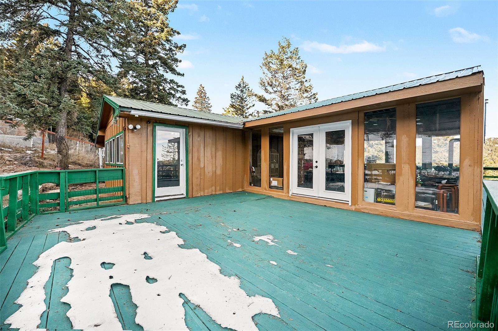10148 South Turkey Creek Road Morrison, CO 80465 - Photo 23 of 50 front view of a house with a yard