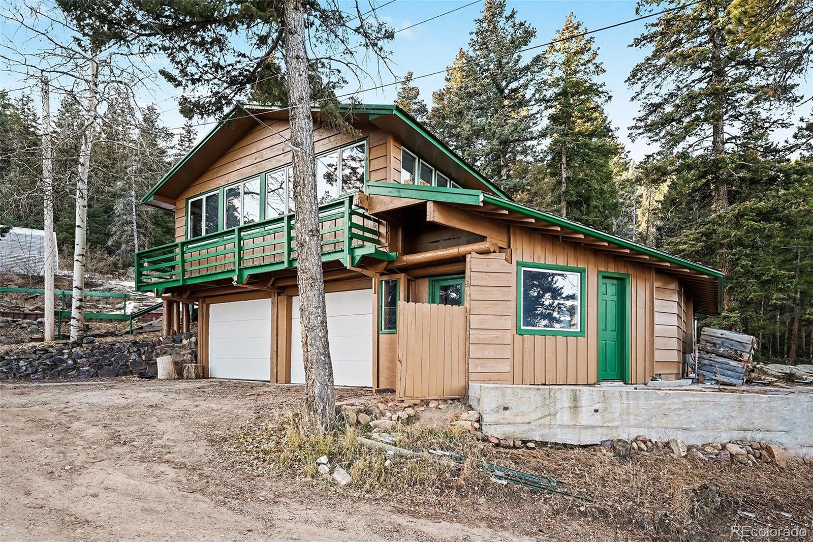 10148 South Turkey Creek Road Morrison, CO 80465 - Photo 27 of 50 a front view of a house with garden