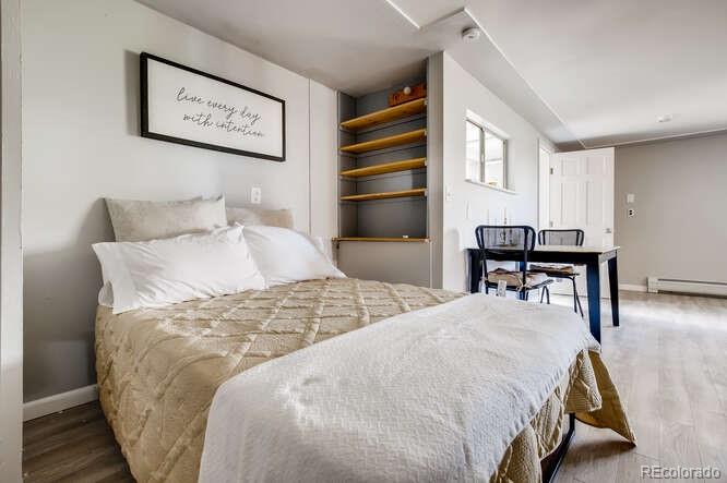 10148 South Turkey Creek Road Morrison, CO 80465 - Photo 34 of 50 a bedroom with a bed and a table