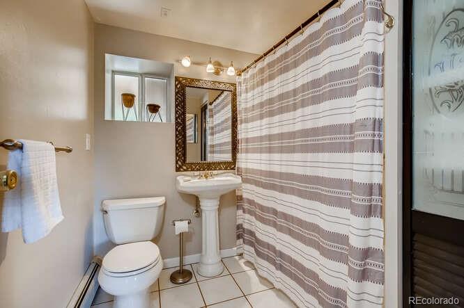 10148 South Turkey Creek Road Morrison, CO 80465 - Photo 35 of 50 a bathroom with a toilet and a shower