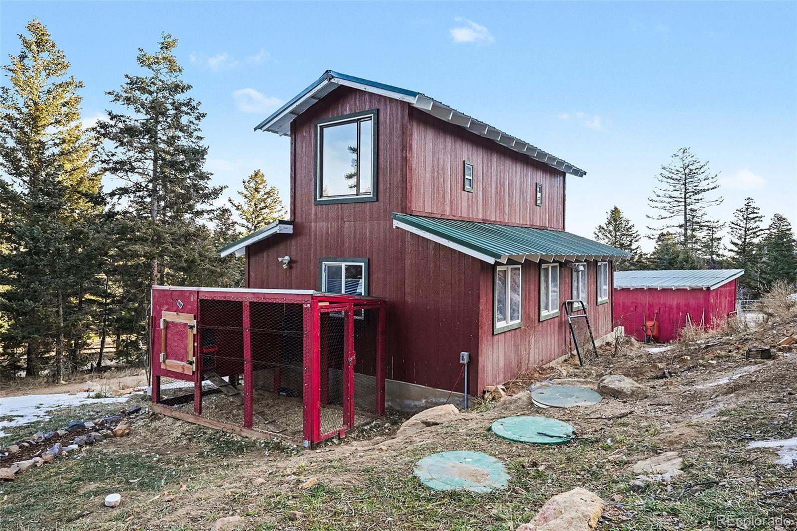 10148 South Turkey Creek Road Morrison, CO 80465 - Photo 36 of 50 a front view of a house with yard
