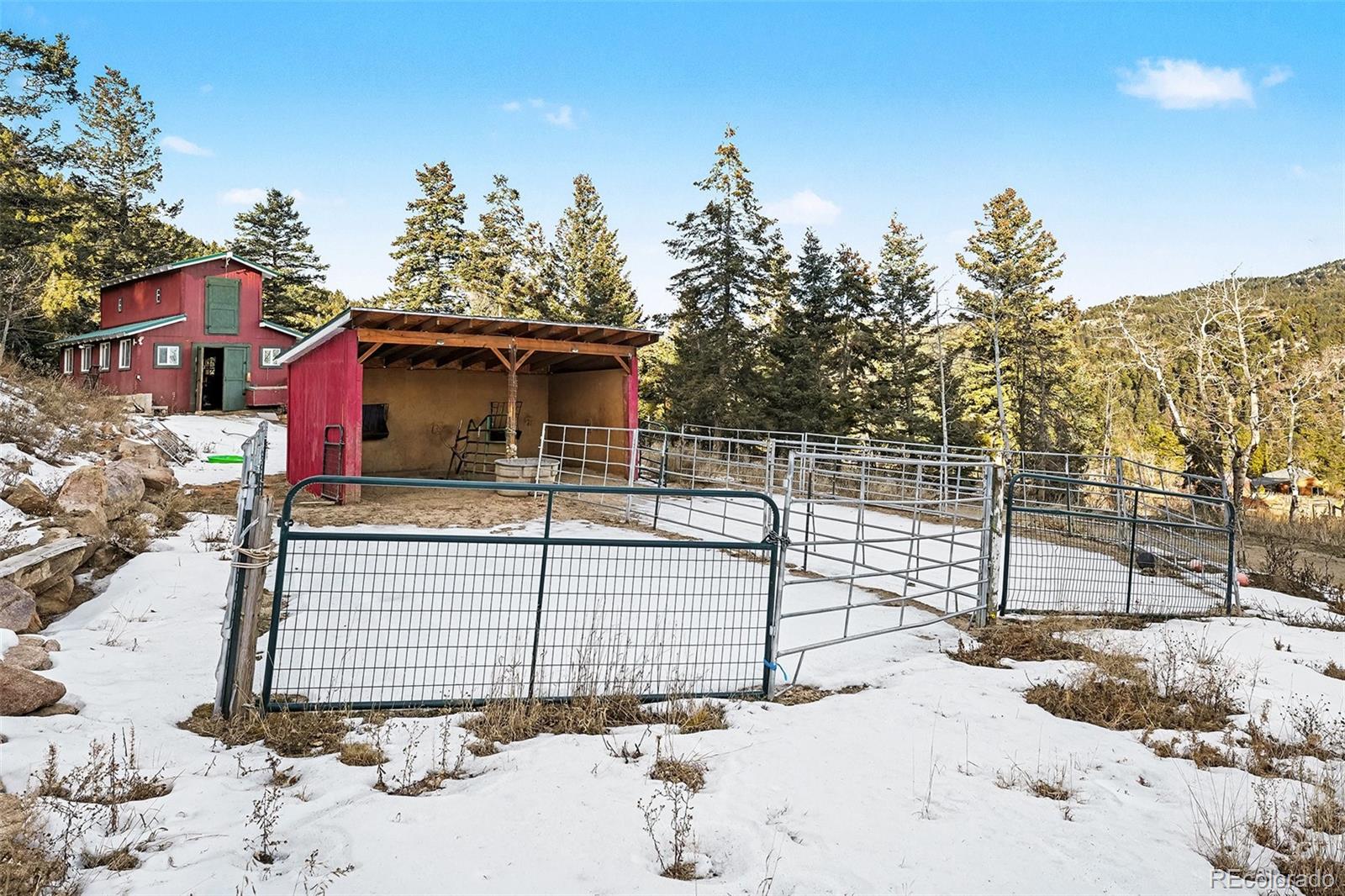 10148 South Turkey Creek Road Morrison, CO 80465 - Photo 37 of 50 a view of a terrace with a bench