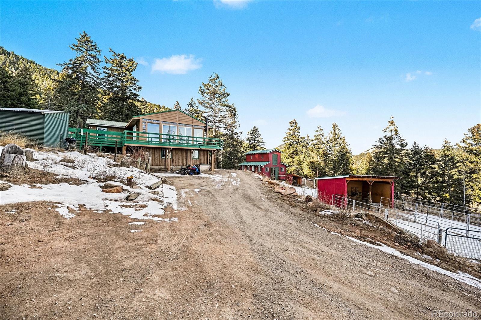 10148 South Turkey Creek Road Morrison, CO 80465 - Photo 41 of 50 a view of a house with a yard
