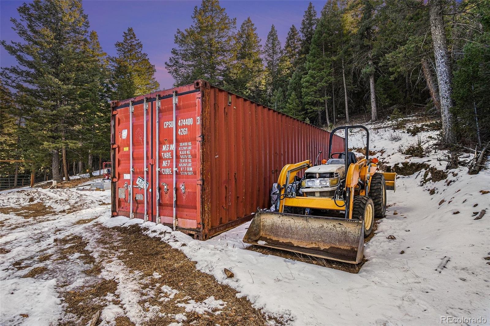 10148 South Turkey Creek Road Morrison, CO 80465 - Photo 44 of 50 a backyard of a house with barbeque oven and trees
