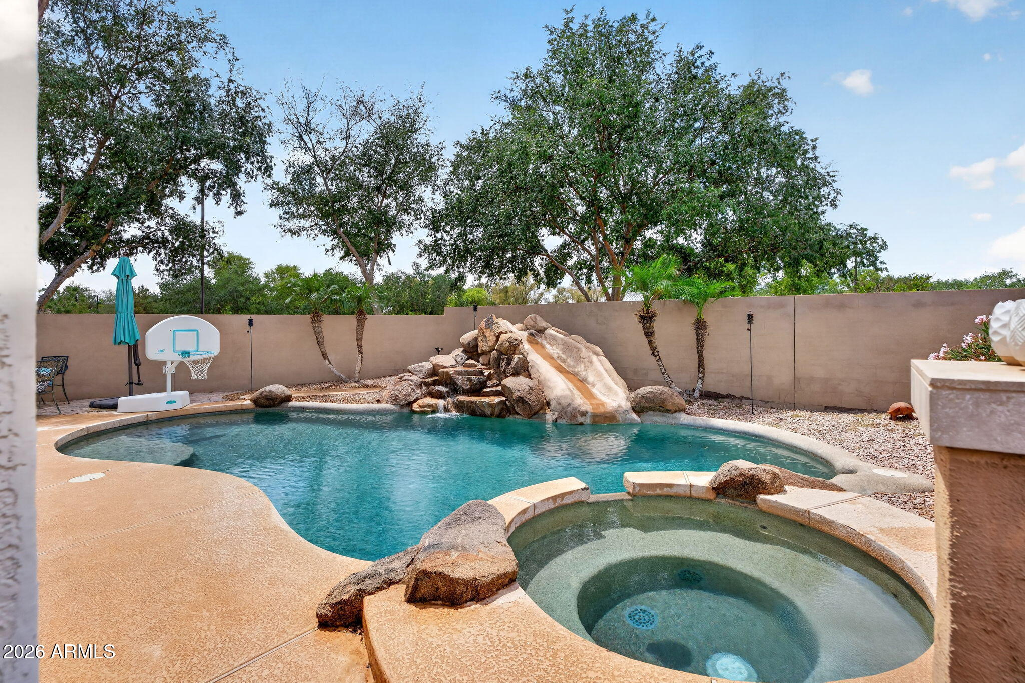 6280 South Sinova Court Gilbert, AZ 85298 - Photo 51 of 64 a backyard of a house with table and chairs