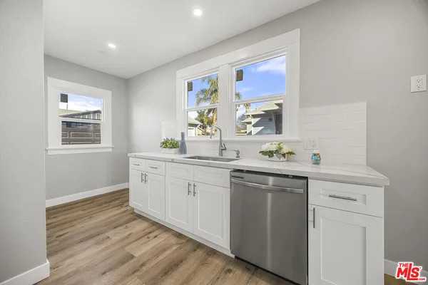a kitchen with sink and window