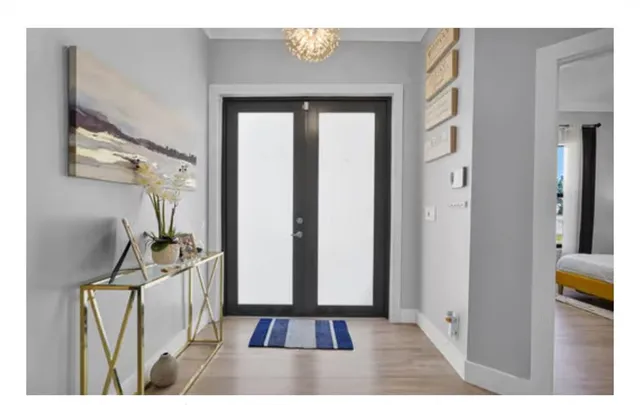 a kitchen with stainless steel appliances kitchen island granite countertop a table and chairs in it