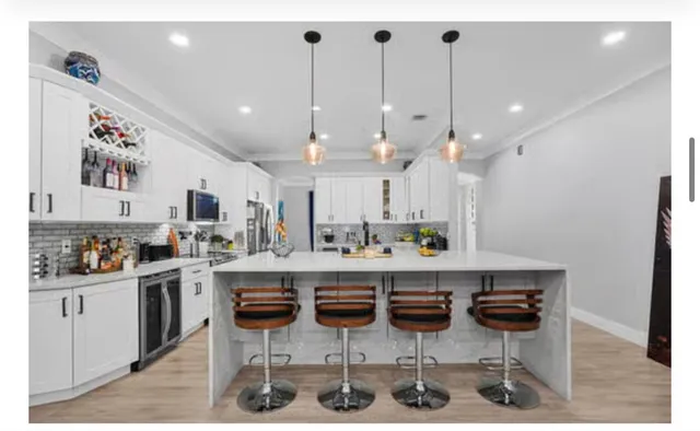 a view of walk in closet with clothes