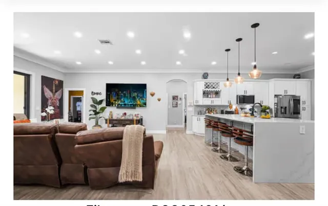 a bathroom with sink mirror bathtub and toilet