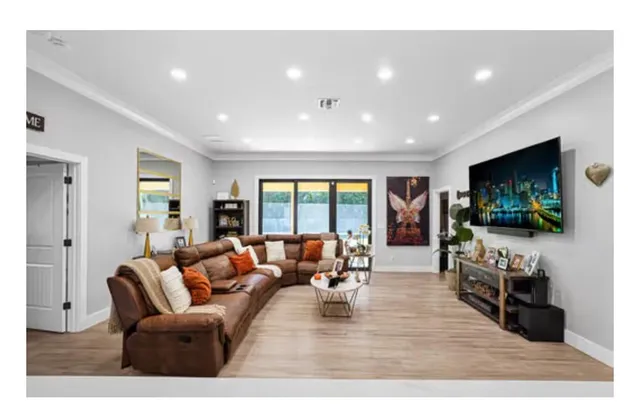 a living room with furniture and a window