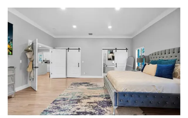 a view of a big room with a floor to ceiling window and a yard