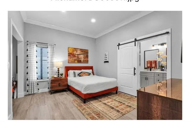 an aerial view of a house with a yard basket ball court