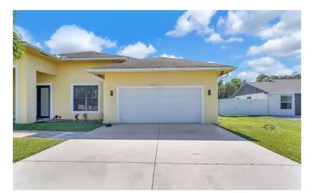 a view of living room with furniture and wooden floor