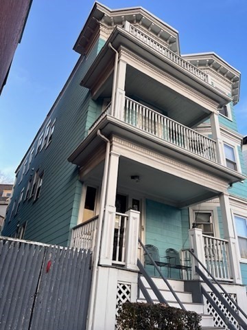 81 Pleasant Street, Unit 3 Boston, MA 02125 - Photo 21 of 21 a view of a house with a balcony
